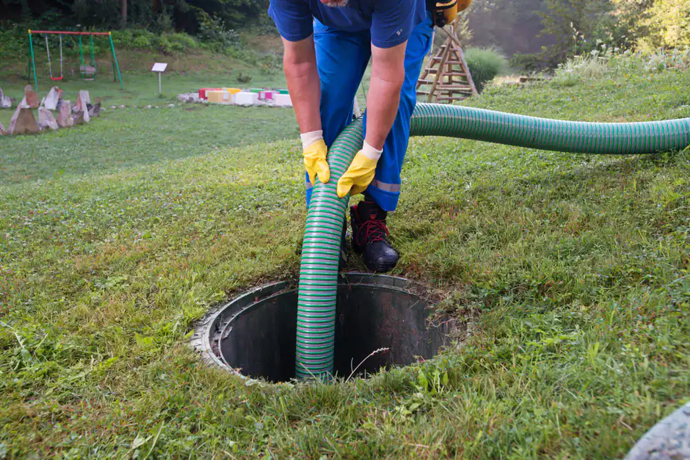 Septic tank emptying in Cook County, Illinois by All Rooter Hydro Jetting, showing technicians pumping and cleaning a residential septic system efficiently