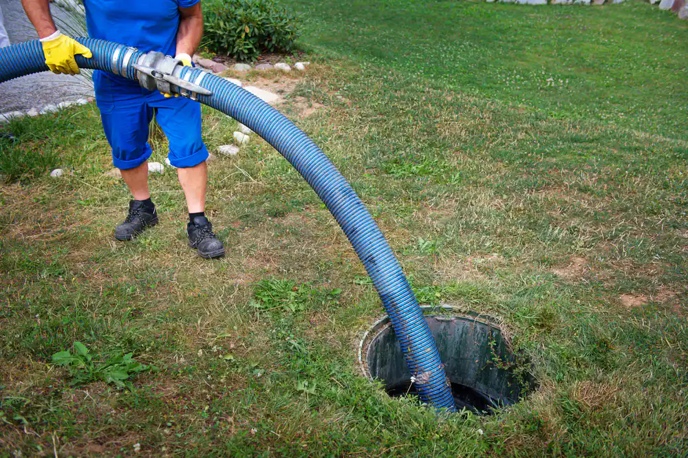 Experienced septic tank maintenance worker servicing a residential system in Cook County, Illinois for All Rooter Hydro Jetting Experts